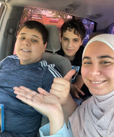 A Picture of my brothers and I, with me being in the forefront of the picture.